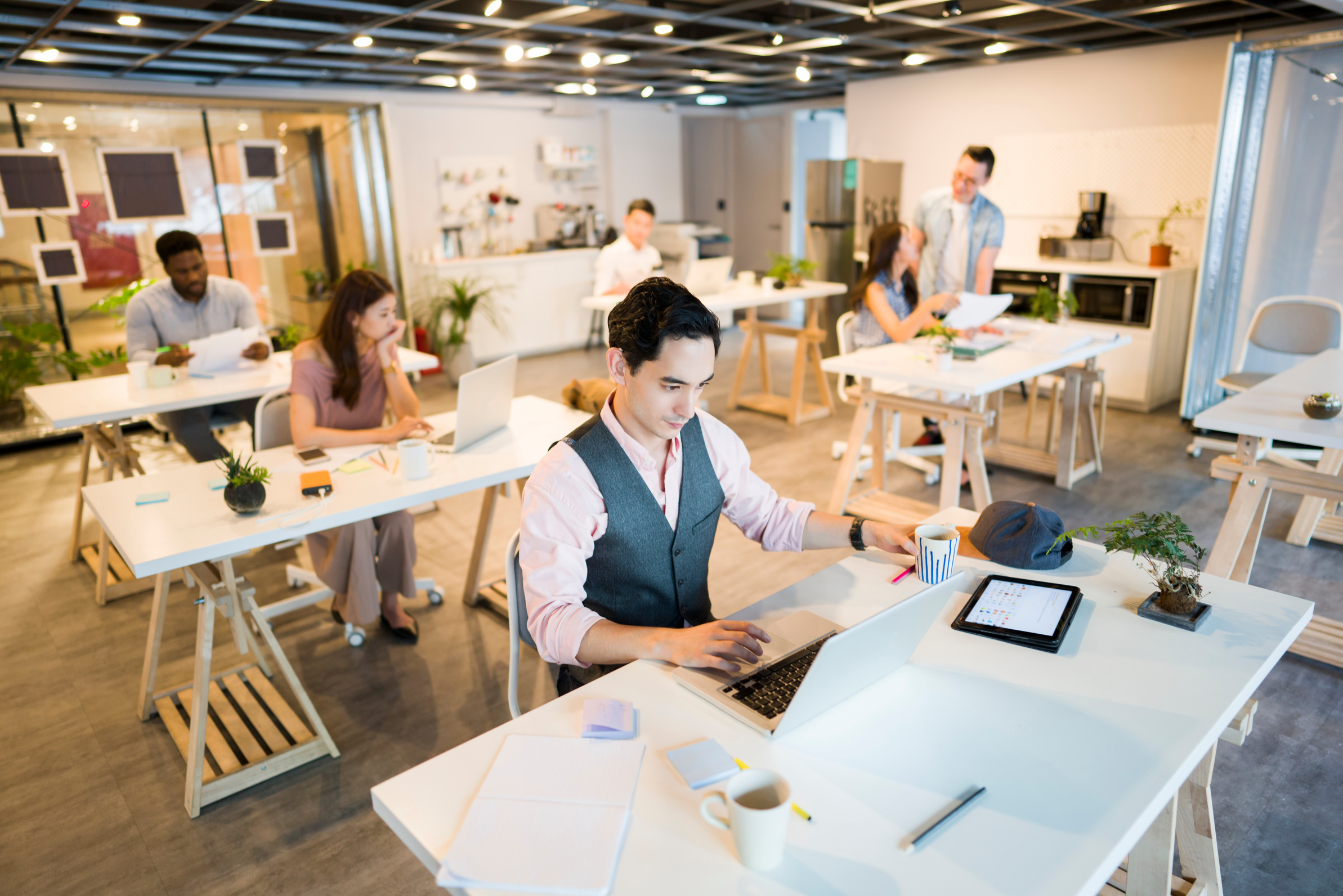 Open plan office full of employees