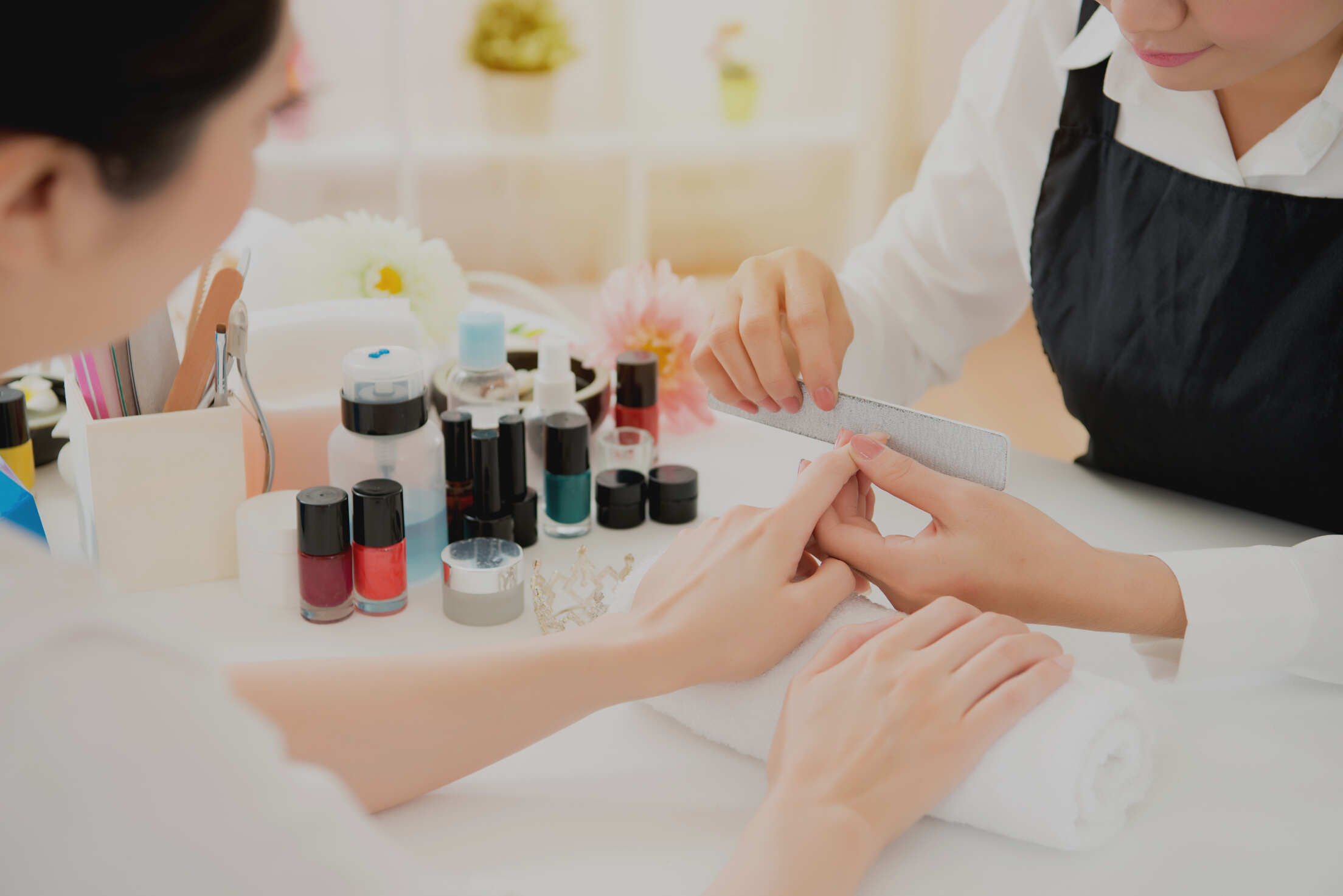 Close up of Manicurist Doing Nails